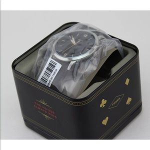 Fossil watch. Brown leather band. Very sleek look!